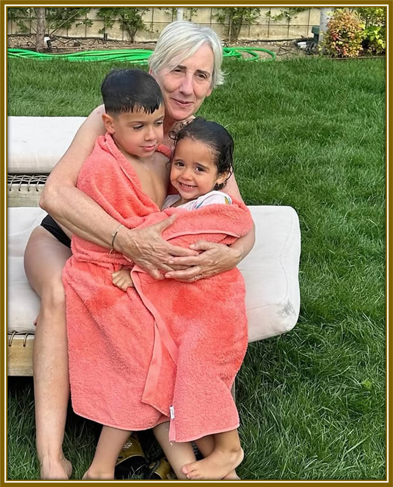 Carmen Iglesias, the heart of the family, sharing precious moments with her grandkids — the joy of family, always close to her heart.