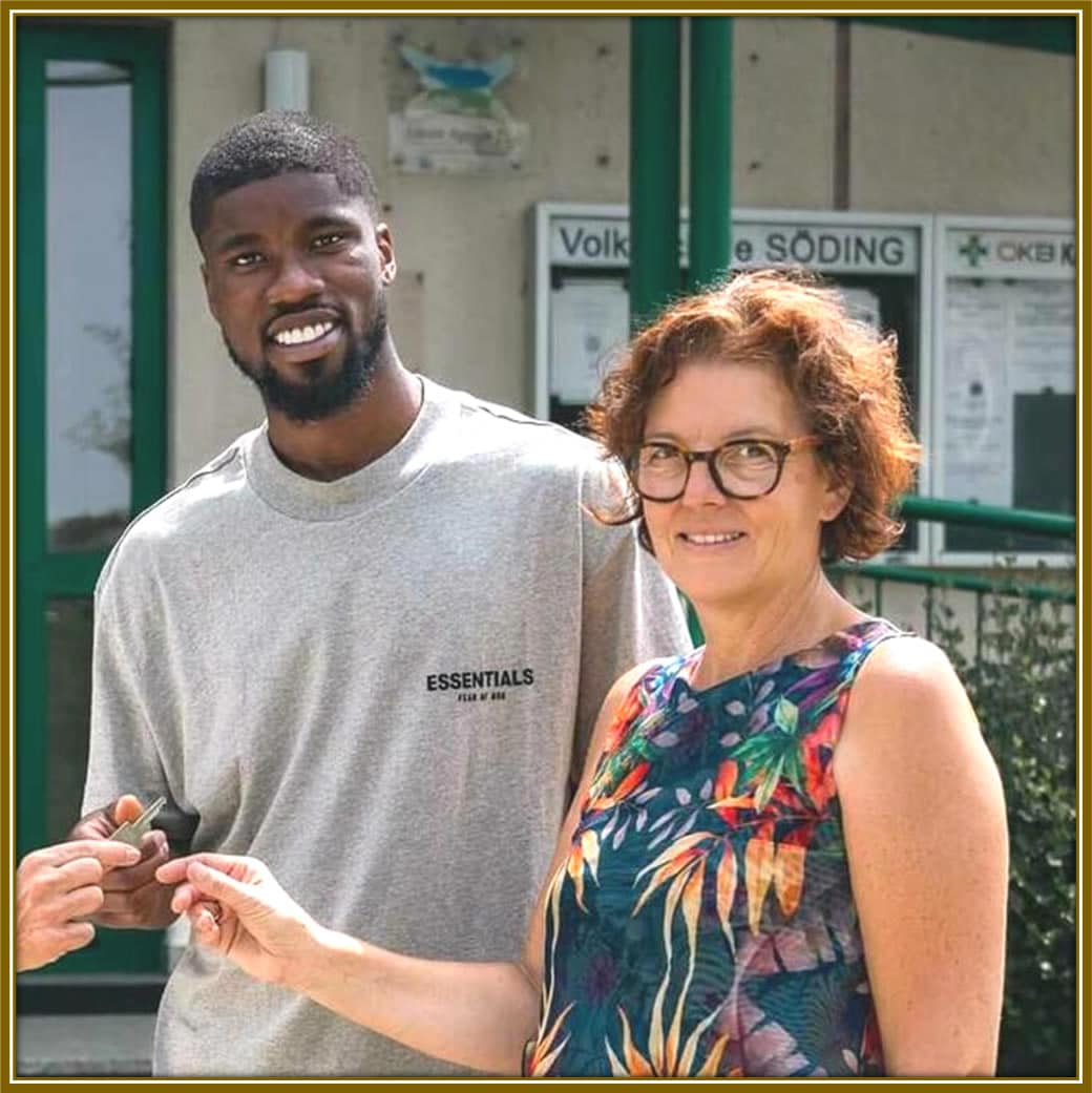 Kevin Danso and his godmother, Christine Lantos, sharing a heartfelt moment—a bond that goes beyond family